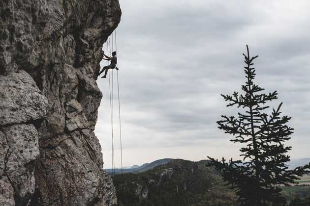 A person climbing outside. Photo by Jonathan Ouimet.